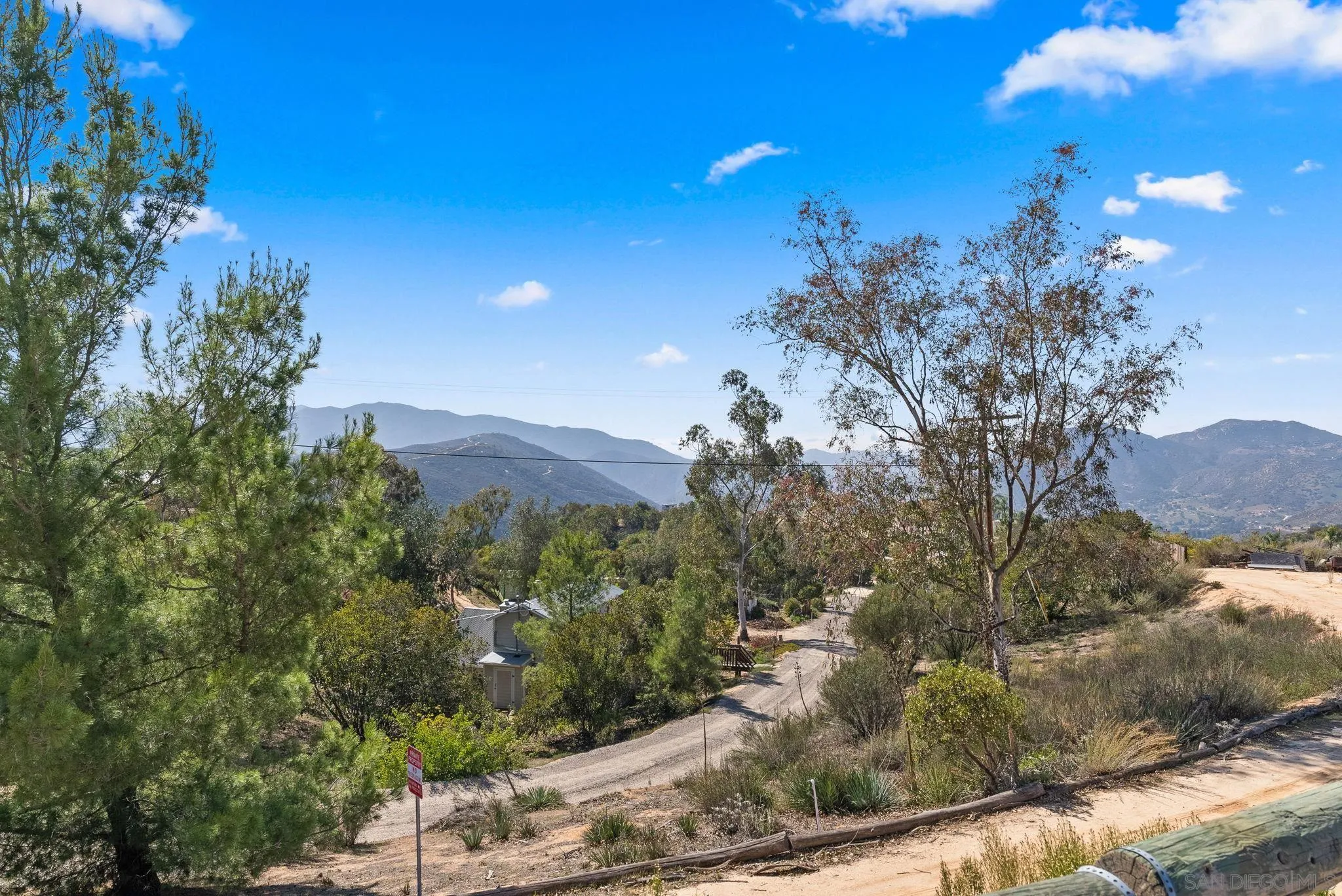 15914 Sequan Truck Trail Alpine, CA 91901 - Photo 62 of 69 a view of a houses with a yard