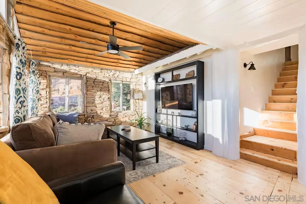 15914 Sequan Truck Trail Alpine, CA 91901 - Photo 7 of 69 a living room with furniture and a flat screen tv