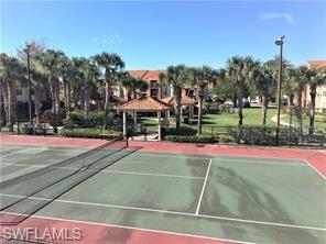 13521 Eagle Ridge Drive, Unit 128 Fort Myers, FL 33912 - Photo 12 of 14 a view of a tennis ground with large trees