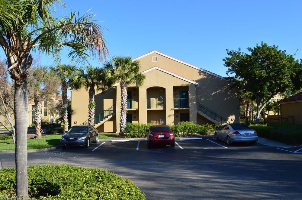 13521 Eagle Ridge Drive, Unit 128 Fort Myers, FL 33912 - Photo 2 of 14 a front view of a house with garden