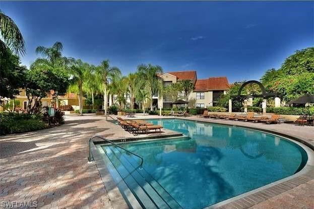 13521 Eagle Ridge Drive, Unit 128 Fort Myers, FL 33912 - Photo 5 of 14 a view of a swimming pool and outdoor space