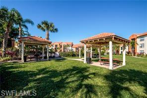 13521 Eagle Ridge Drive, Unit 128 Fort Myers, FL 33912 - Photo 8 of 14 a view of a house with a yard