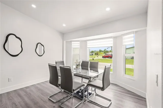 a workspace with table chair and a window