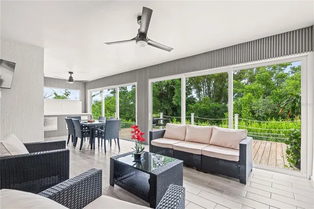 a living room with furniture and a large window