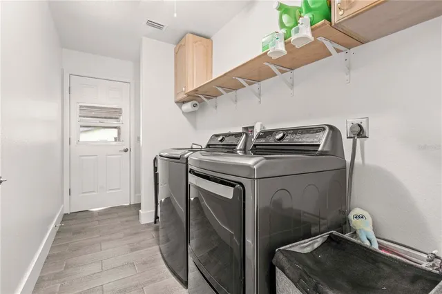 a utility room with dryer and washer
