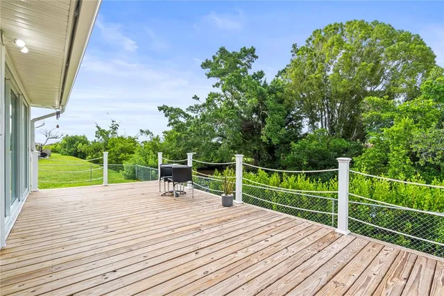 a view of a chairs and table on the wooden floor