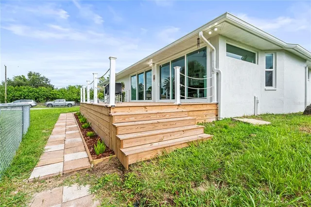 a view of a pathway with plants