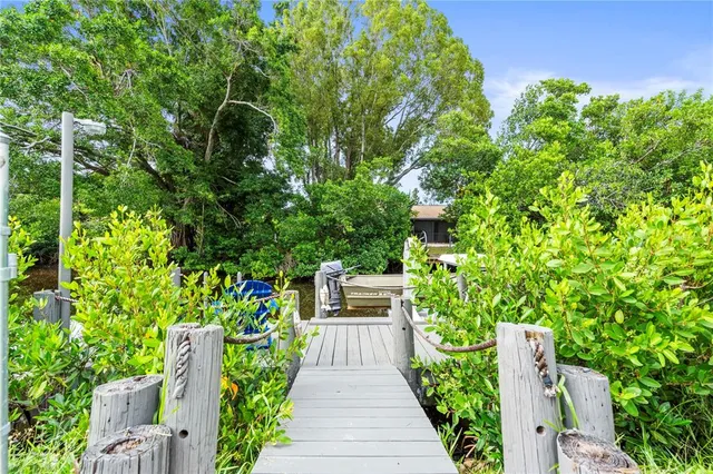 a view of a wooden deck with a lake