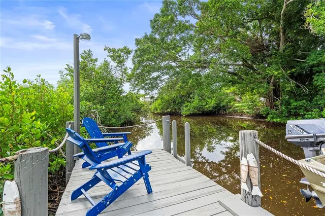 a view of an chair and table in the roof deck