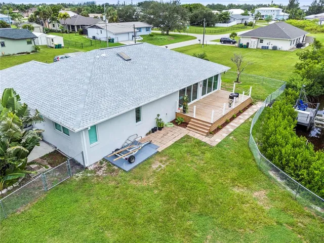 an aerial view of a house with a garden