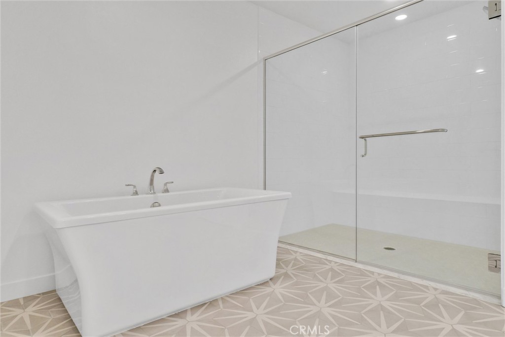 4302 Rivington Irvine, CA 92612 - Photo 38 of 63 a bathroom with a bathtub and shower