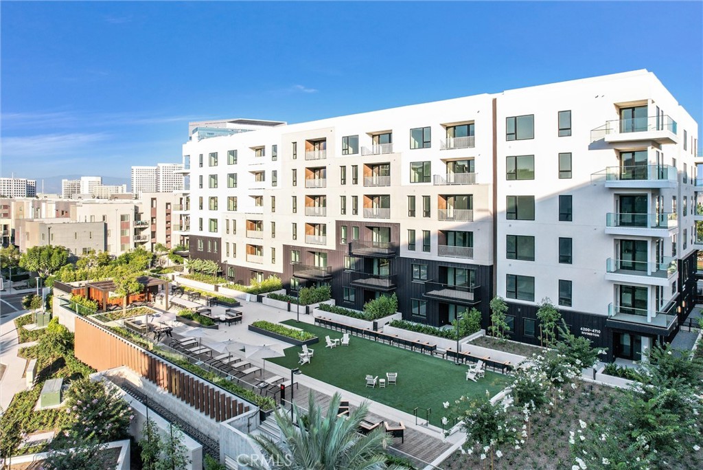 4302 Rivington Irvine, CA 92612 - Photo 4 of 63 a front view of a building with swimming pool and outdoor space