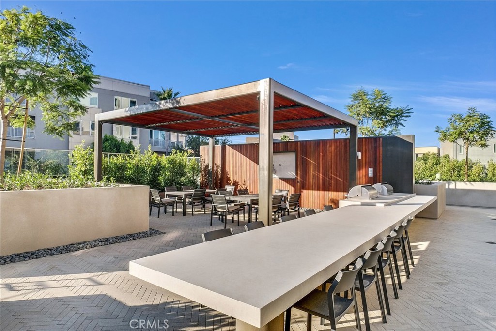 4302 Rivington Irvine, CA 92612 - Photo 50 of 63 a patio with table and chairs and potted plants