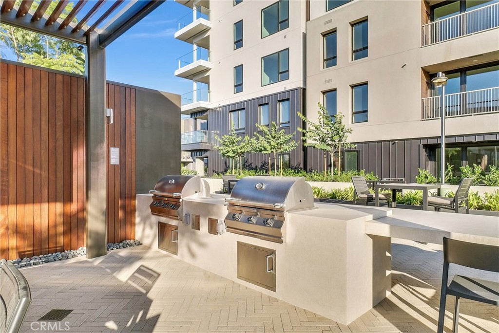 4302 Rivington Irvine, CA 92612 - Photo 51 of 63 a view of a patio with table and chairs and potted plants