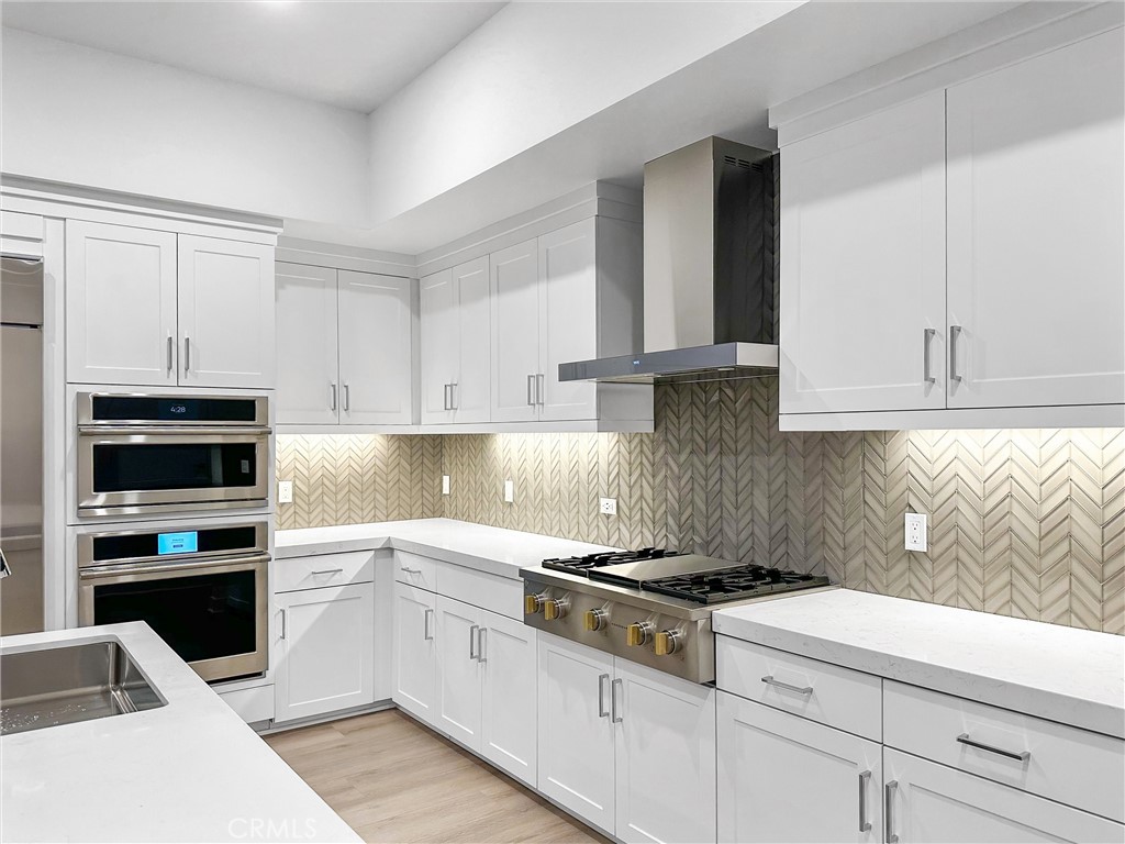 4302 Rivington Irvine, CA 92612 - Photo 59 of 63 a kitchen with cabinets appliances and a window