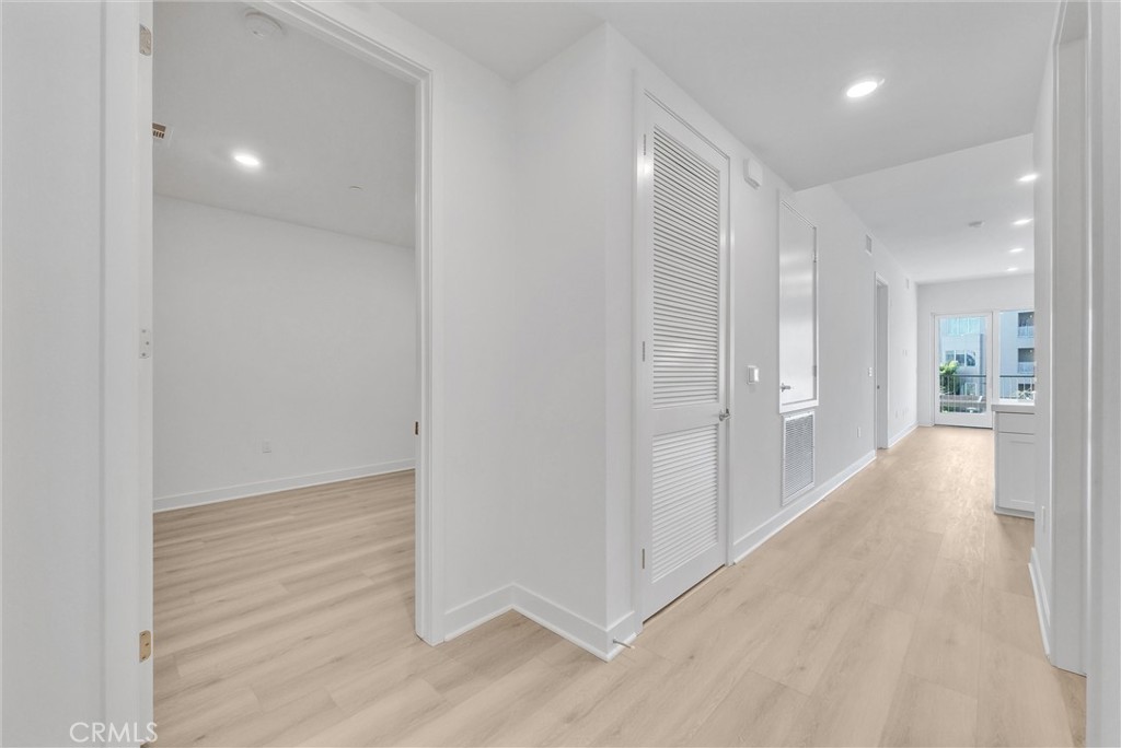 4302 Rivington Irvine, CA 92612 - Photo 6 of 63 a view of a hallway with wooden floor