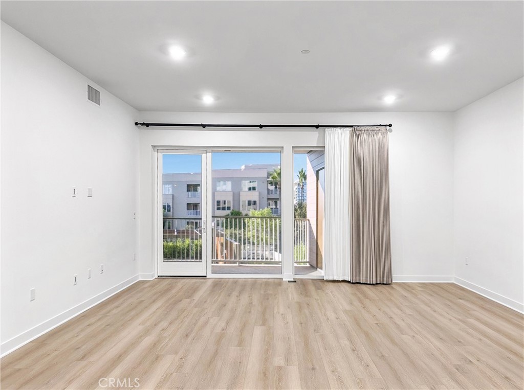 4302 Rivington Irvine, CA 92612 - Photo 62 of 63 wooden floor in an empty room with a window