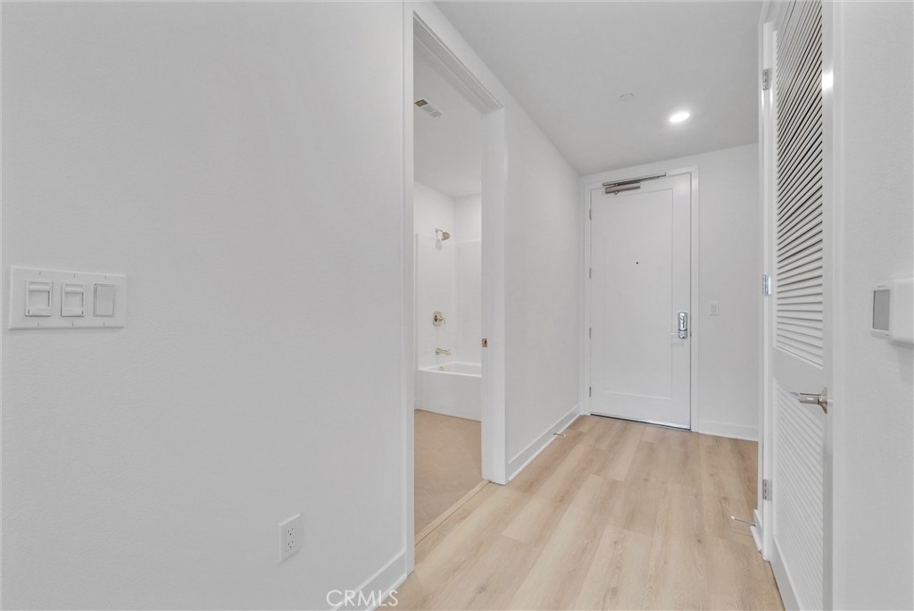4302 Rivington Irvine, CA 92612 - Photo 7 of 63 a view of a hallway with wooden floor