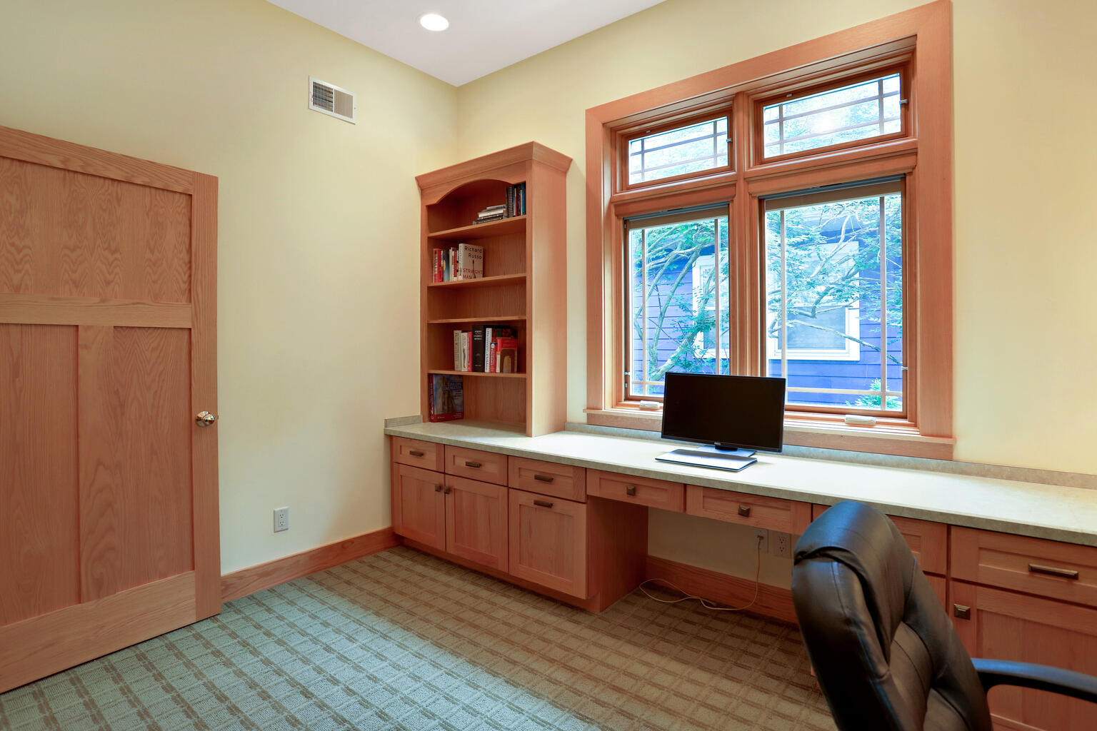 1011 West Charles Street Champaign, IL 61821 - Photo 18 of 51 a view of a workspace with wooden floor and a window