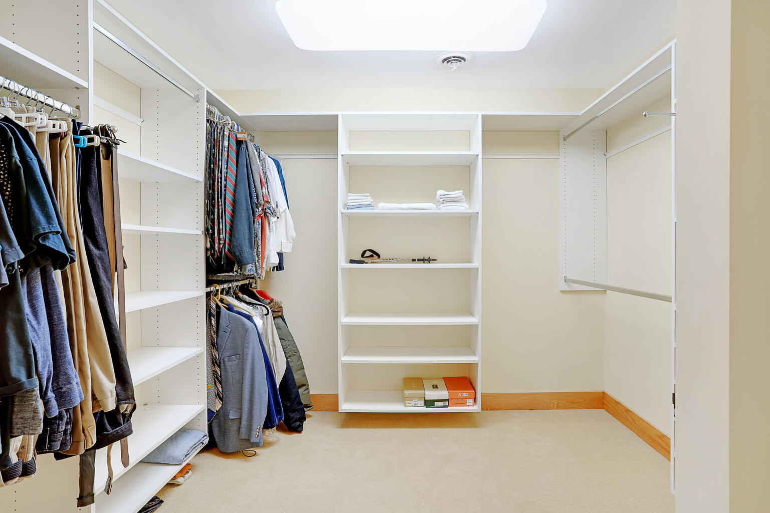 1011 West Charles Street Champaign, IL 61821 - Photo 24 of 51 a view of walk in closet with clothes and shoes
