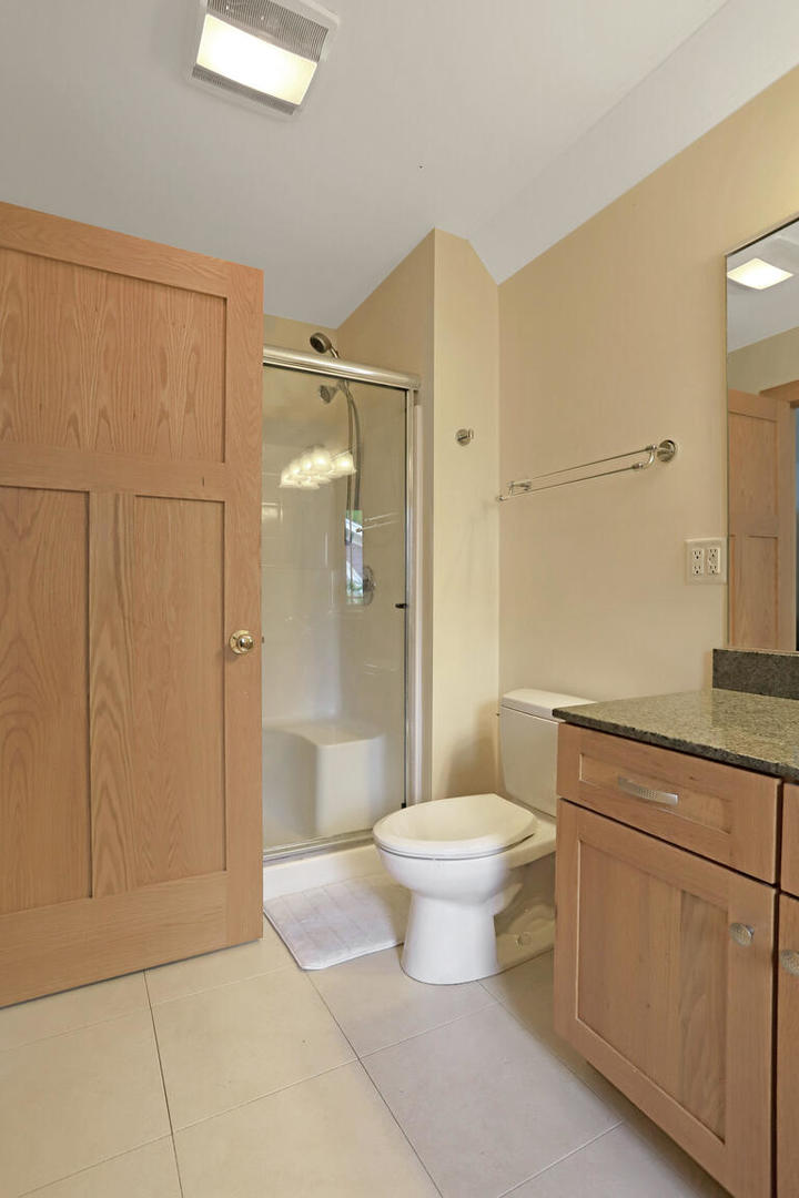 1011 West Charles Street Champaign, IL 61821 - Photo 33 of 51 a bathroom with a toilet sink and shower