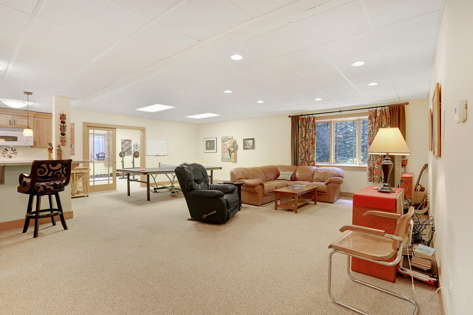 1011 West Charles Street Champaign, IL 61821 - Photo 35 of 51 a living room with furniture and a flat screen tv