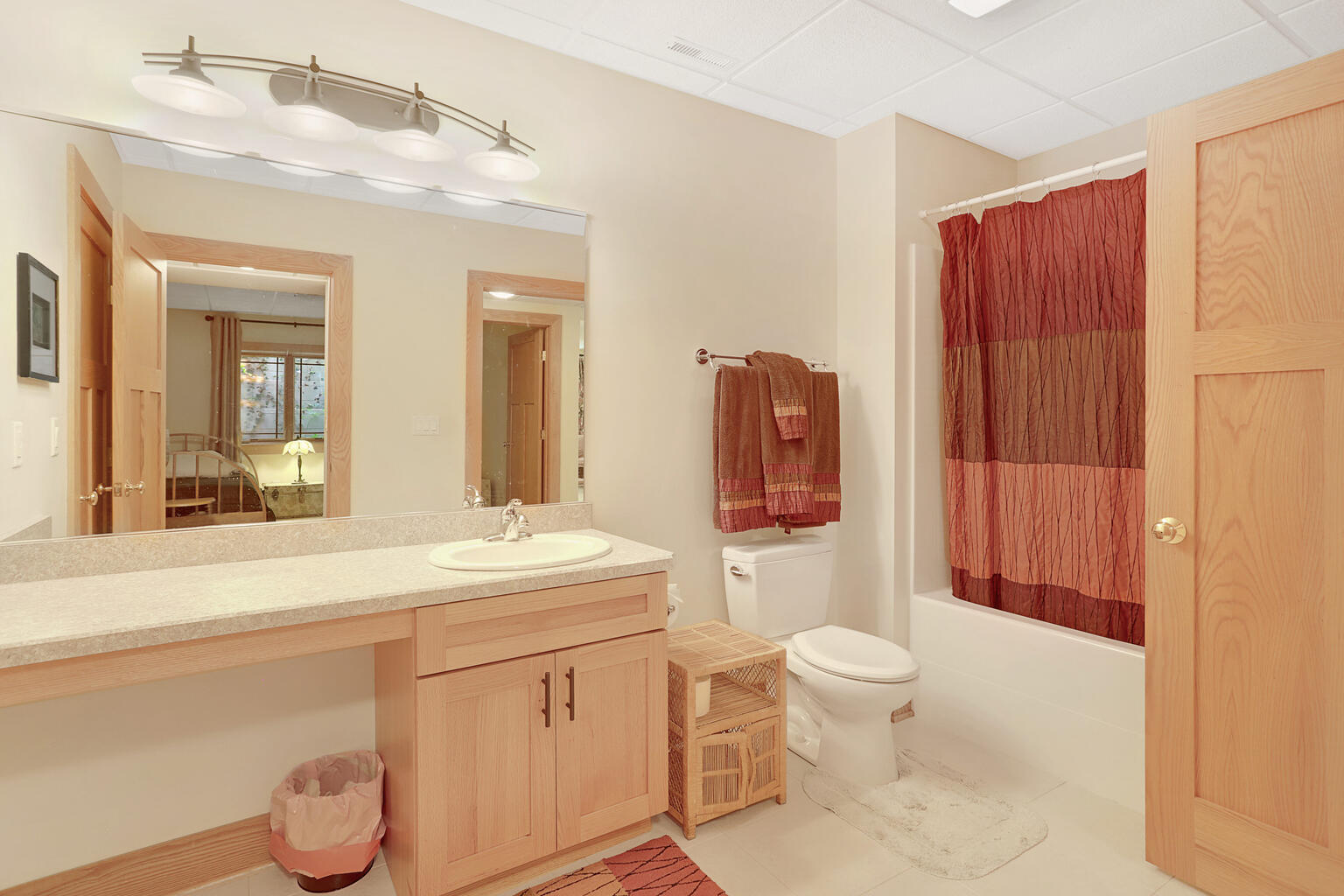 1011 West Charles Street Champaign, IL 61821 - Photo 44 of 51 a bathroom with a sink a toilet and a mirror