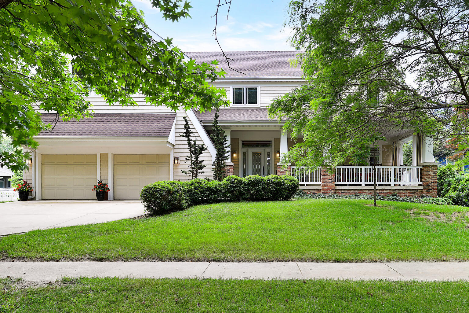 1011 West Charles Street Champaign, IL 61821 - Photo 48 of 51 a front view of a house with a garden and yard