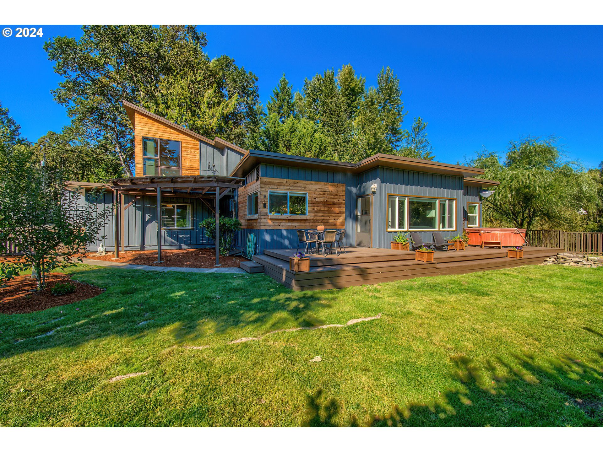 450 Frank Johns Road Stevenson, WA 98648 - Photo 36 of 36 a view of a house with a yard porch and sitting area