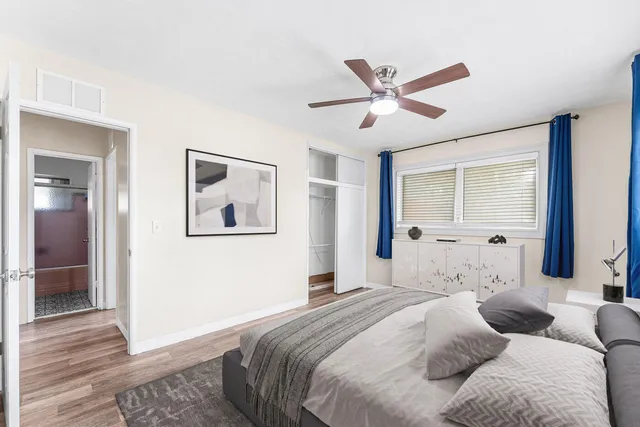 a bedroom with a large bed and a window