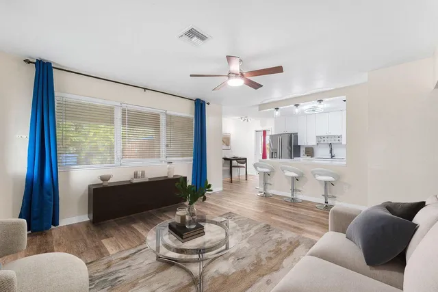 a living room with furniture and a large window