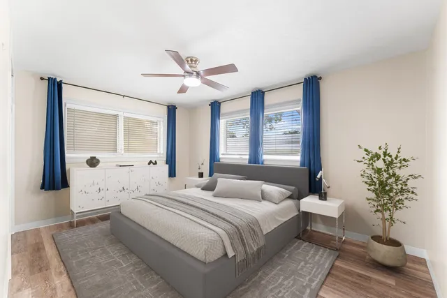 a bedroom with a large bed and a window