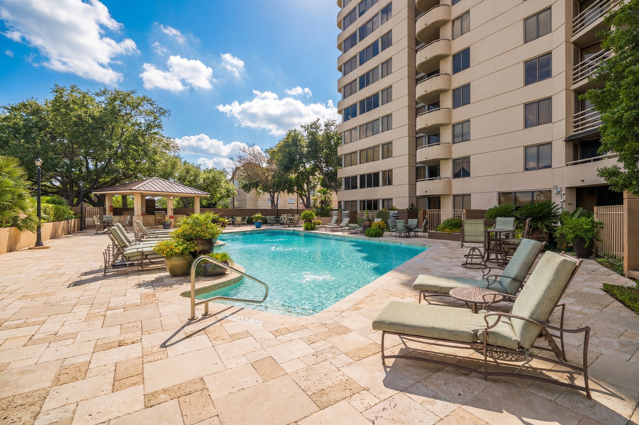 3525 Sage Road, Unit 1016 Houston, TX 77056 - Photo 12 of 42 a view of a building with garden and sitting area