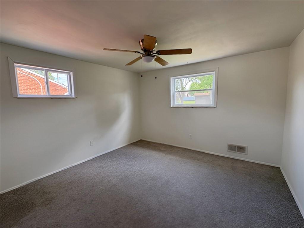 279 Olympic Road Pittsburgh, PA 15236 - Photo 19 of 25 an empty room with windows and fan