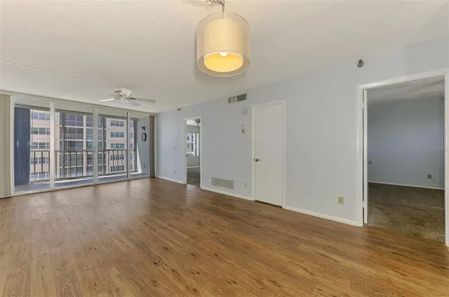 a view of an empty room with a window