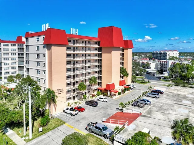 a group of cars sitting in front of buildings