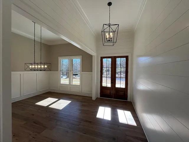 a view of entryway and hall with a window