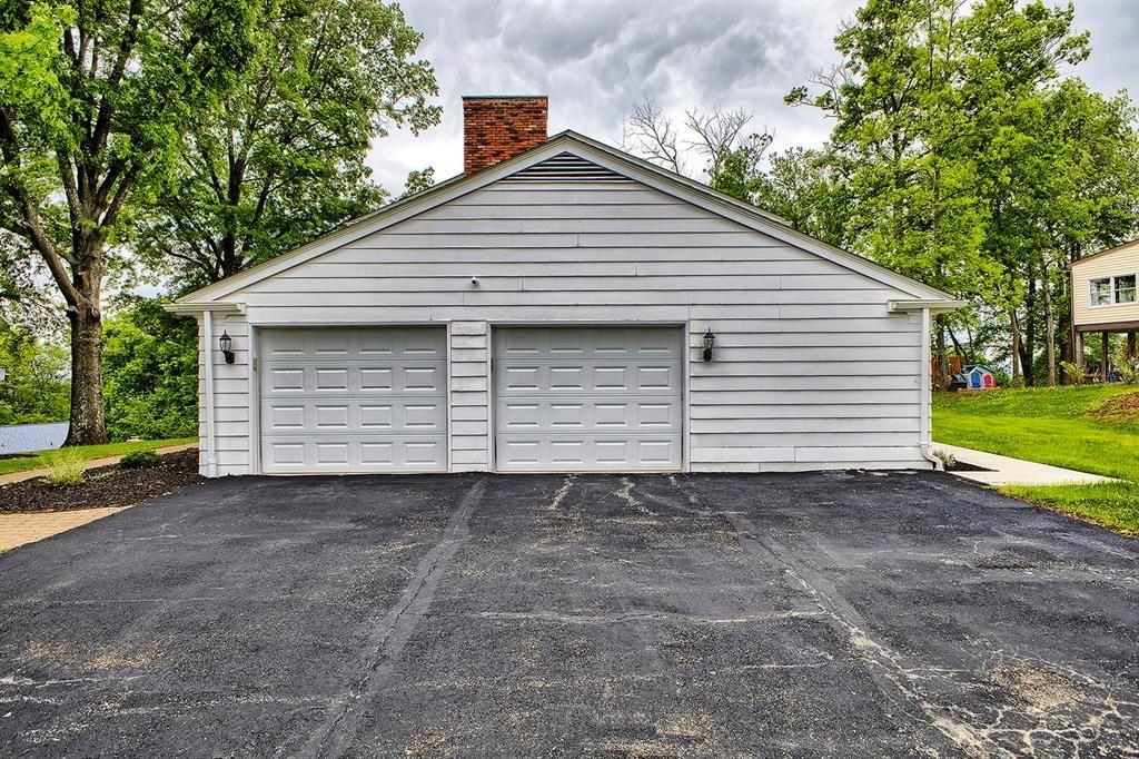 3222 Ridgeway Road Greensburg, PA 15601 - Photo 9 of 46 a front view of a house with a yard and garage