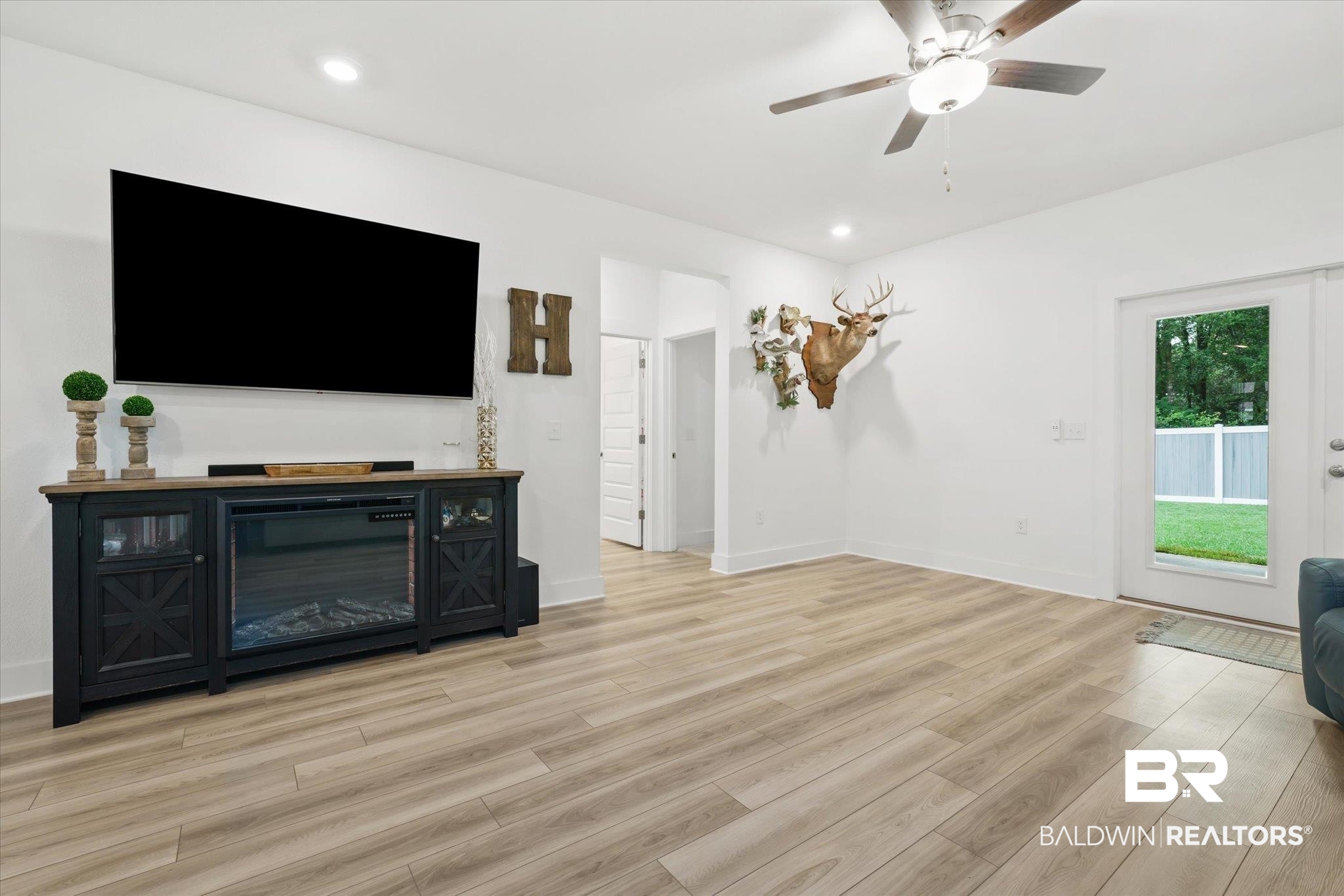 263 Bronze Street Fairhope, AL 36532 - Photo 5 of 47 Living room featuring ceiling fan and light hardwood / wood-style flooring