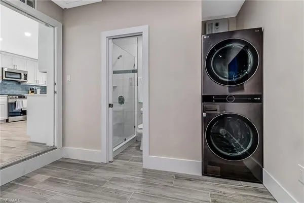 a view of a hallway with washer and dryer