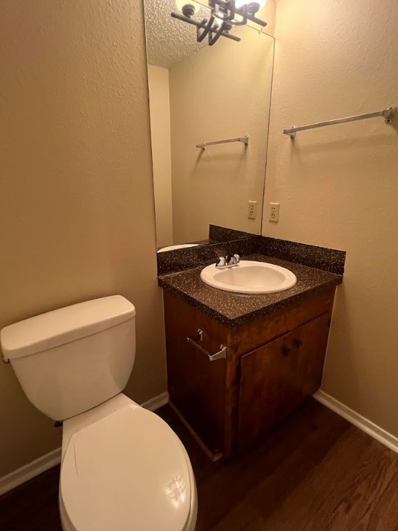 3000 South 1st Street, Unit 104 Austin, TX 78704 - Photo 11 of 31 a bathroom with a toilet a sink and mirror