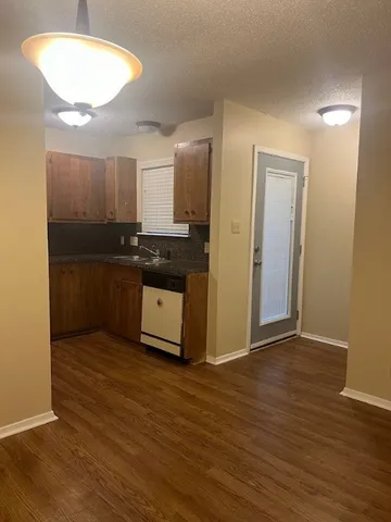 a view of cabinets and wooden floor