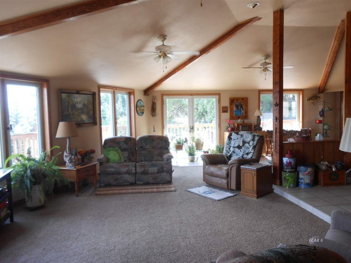 9039 Ruby Valley Road Spring Creek, NV 89815 - Photo 30 of 47 a living room with furniture and a large window