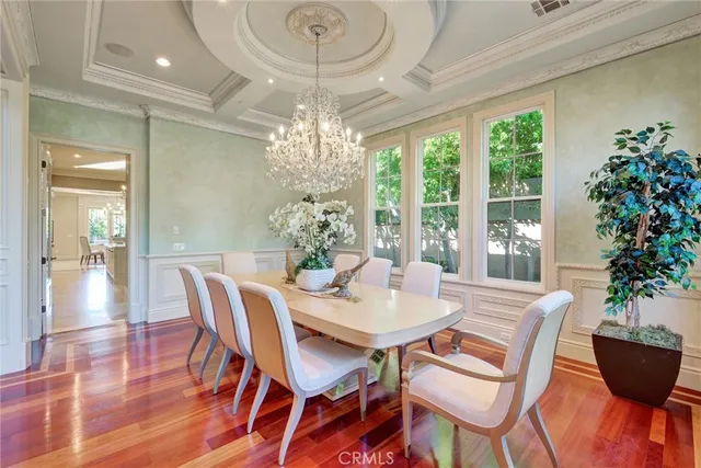 a kitchen with kitchen island granite countertop a sink stove and cabinets