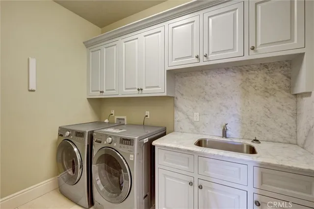 a bathroom with a granite countertop toilet sink and mirror