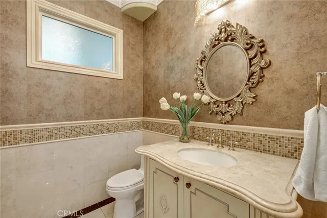 a kitchen with stainless steel appliances granite countertop a stove and a sink