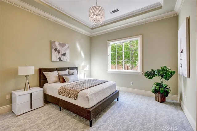 a bedroom with furniture and a window