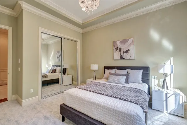 a bathroom with a granite countertop toilet a sink and a mirror