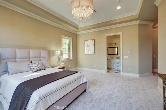 a bathroom with a granite countertop sink a mirror and a shower