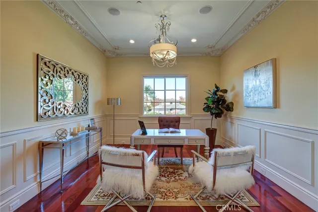 a view of a swimming pool with a garden and patio